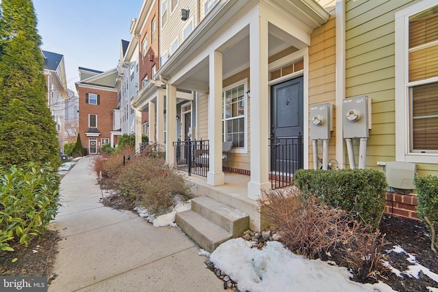 view of exterior entry featuring a porch