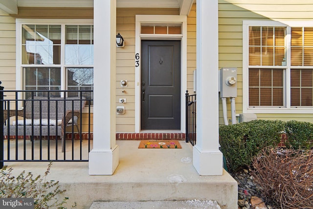 doorway to property with a porch