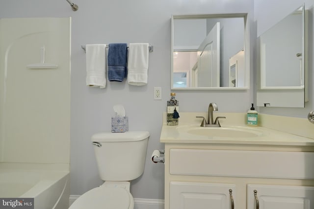 full bathroom with shower / washtub combination, vanity, and toilet