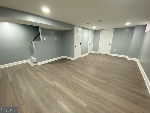 basement with hardwood / wood-style floors