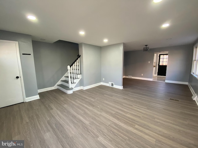 unfurnished living room featuring wood-type flooring