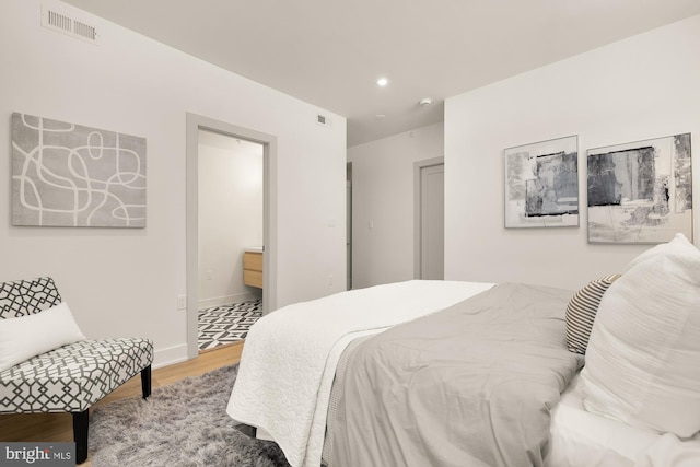 bedroom featuring hardwood / wood-style floors