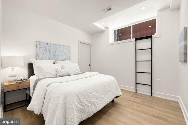 bedroom featuring light wood-type flooring