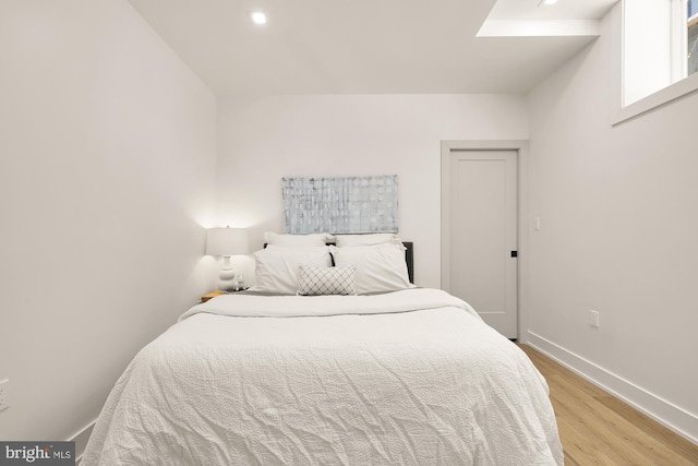 bedroom with light hardwood / wood-style flooring