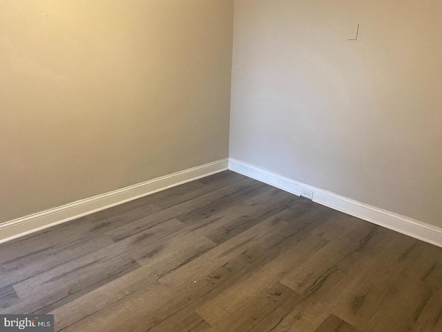 empty room featuring dark hardwood / wood-style floors