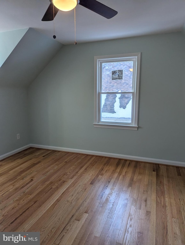 additional living space featuring ceiling fan, wood-type flooring, and lofted ceiling