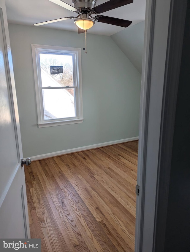 additional living space featuring ceiling fan, light hardwood / wood-style flooring, and lofted ceiling