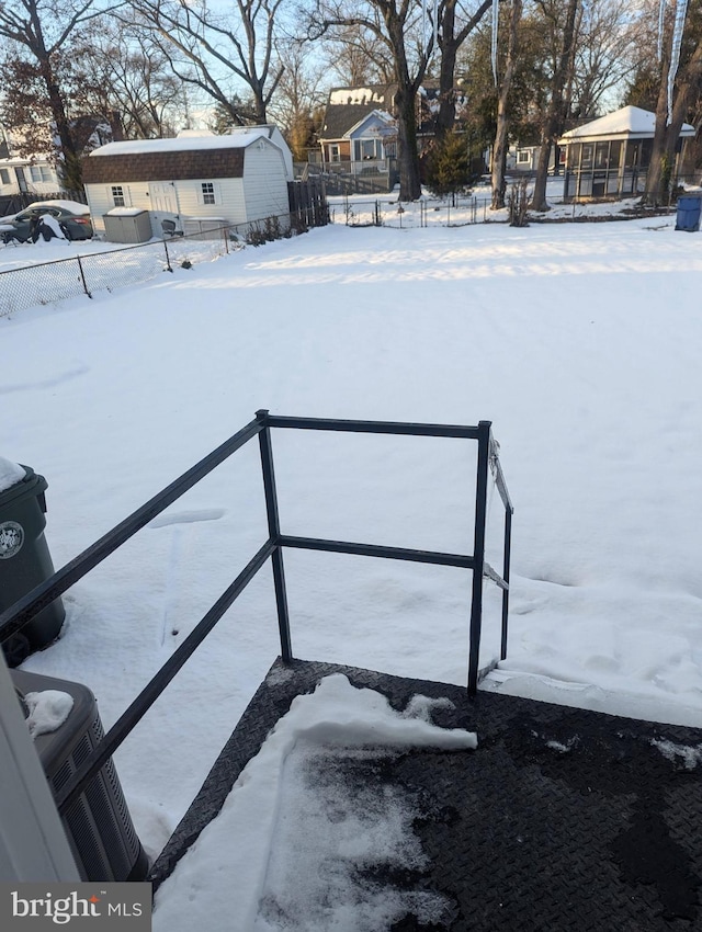 view of yard layered in snow