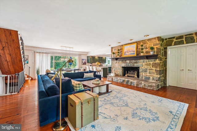 living room with a fireplace and hardwood / wood-style floors