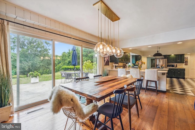 dining space with dark hardwood / wood-style floors