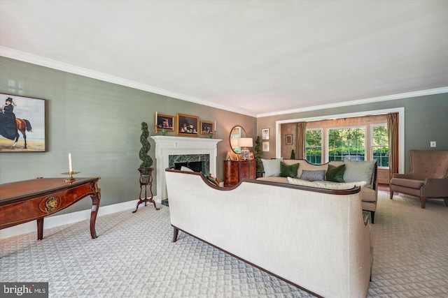 living room featuring a high end fireplace, carpet flooring, and crown molding