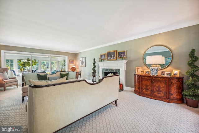 carpeted living room featuring a premium fireplace and ornamental molding