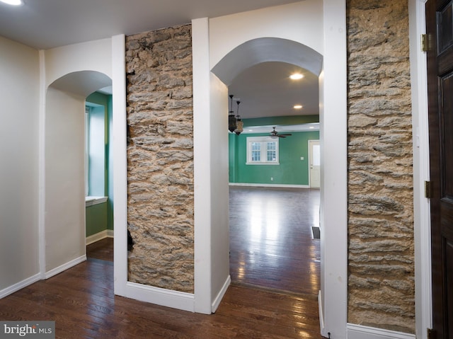 hallway with dark hardwood / wood-style floors