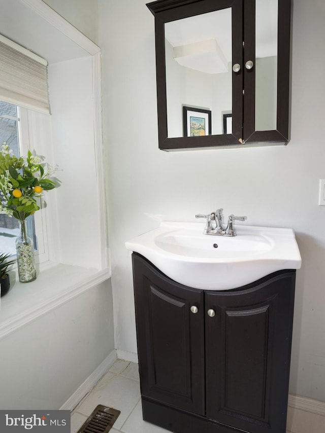 bathroom with vanity and tile patterned flooring