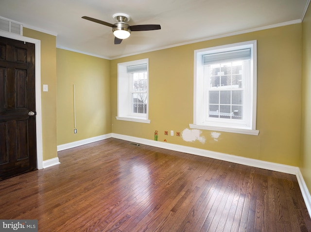 unfurnished room with dark hardwood / wood-style flooring, ornamental molding, and ceiling fan