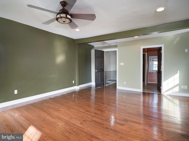 unfurnished room featuring hardwood / wood-style floors and ceiling fan