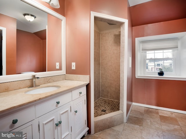 bathroom featuring vanity and a tile shower