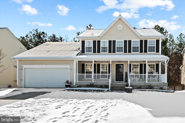 colonial inspired home featuring a porch and a garage