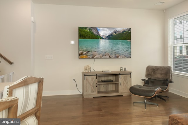 sitting room with dark hardwood / wood-style flooring