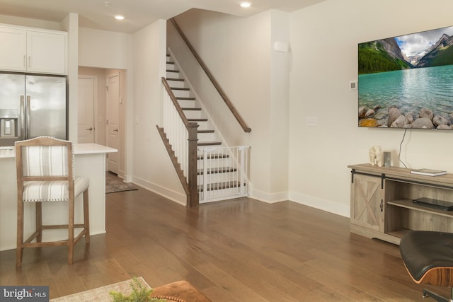 stairway featuring hardwood / wood-style flooring