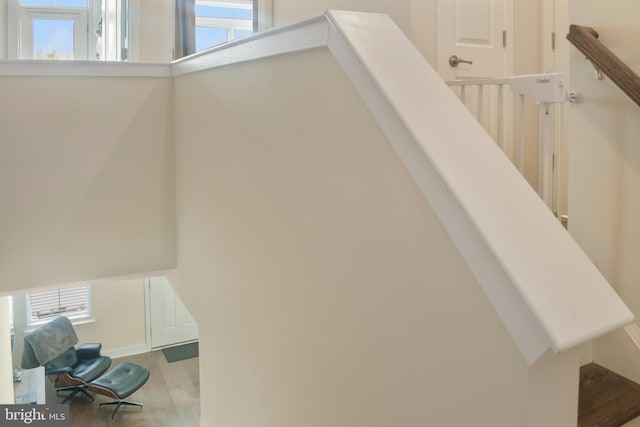 stairs featuring hardwood / wood-style flooring