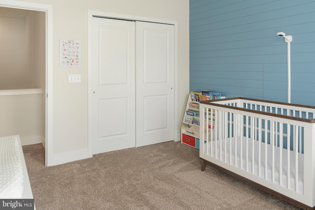 unfurnished bedroom featuring a closet and carpet floors