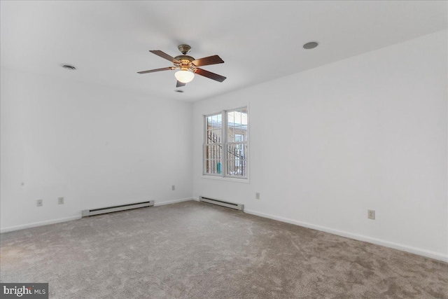 unfurnished room with ceiling fan, a baseboard radiator, and light carpet