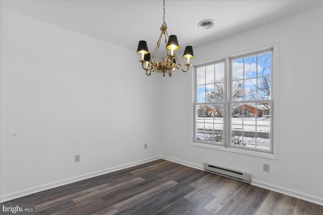 empty room with dark hardwood / wood-style floors, an inviting chandelier, and baseboard heating