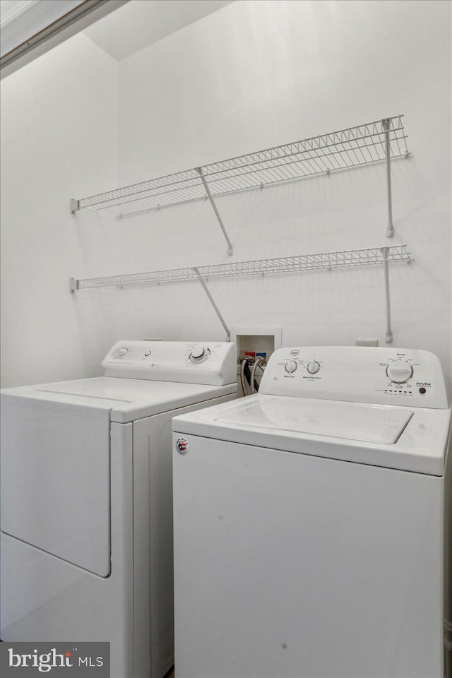 laundry area with washing machine and dryer