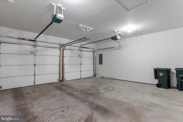 garage with electric panel and a garage door opener