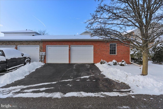 view of snow covered garage