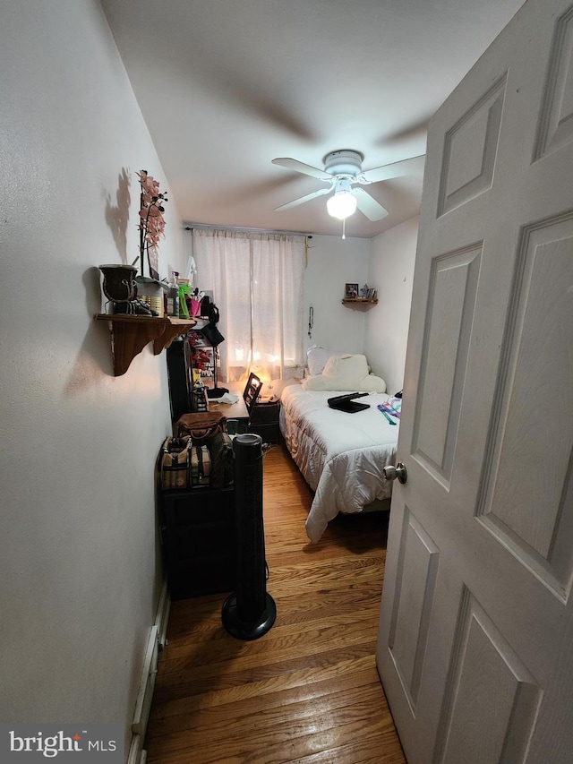 bedroom featuring ceiling fan and hardwood / wood-style flooring