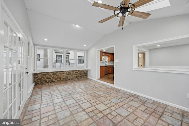 unfurnished living room featuring lofted ceiling and ceiling fan