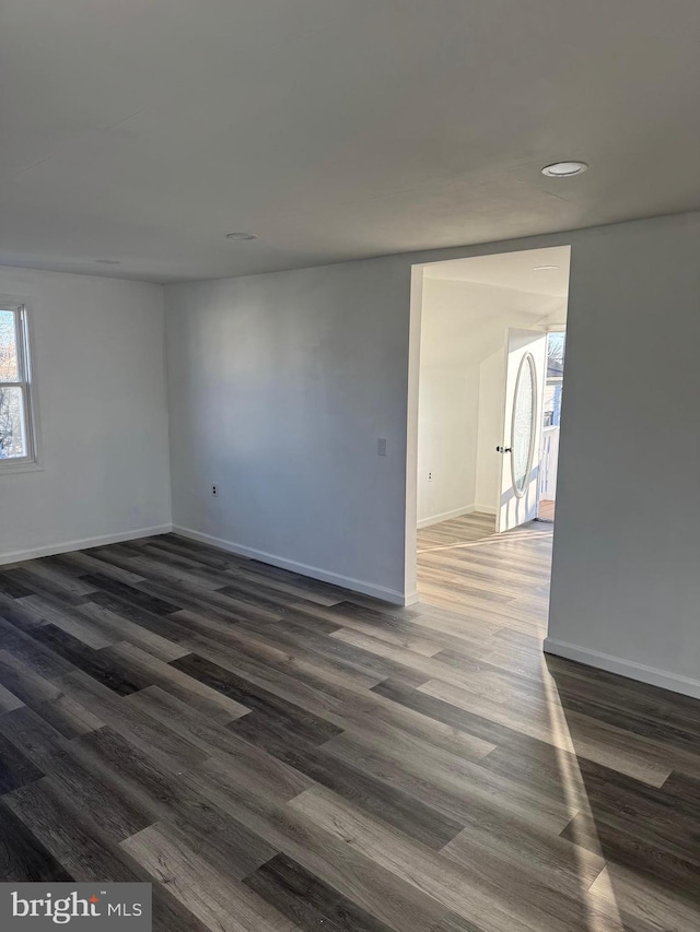 unfurnished room featuring dark hardwood / wood-style floors