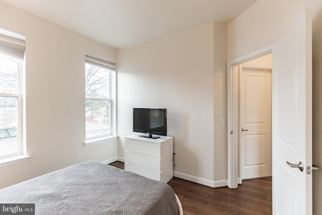 bedroom featuring dark wood-type flooring