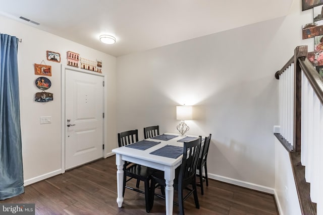 dining room with dark hardwood / wood-style floors