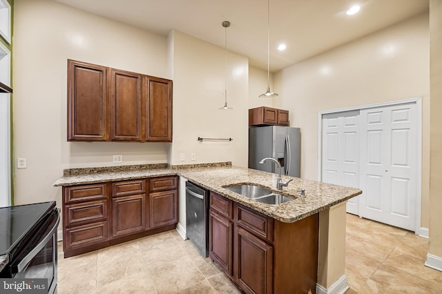 kitchen with light stone countertops, pendant lighting, stainless steel appliances, sink, and kitchen peninsula