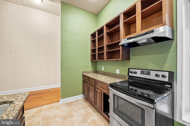 kitchen with extractor fan, light tile patterned flooring, stainless steel electric stove, a textured ceiling, and light stone counters