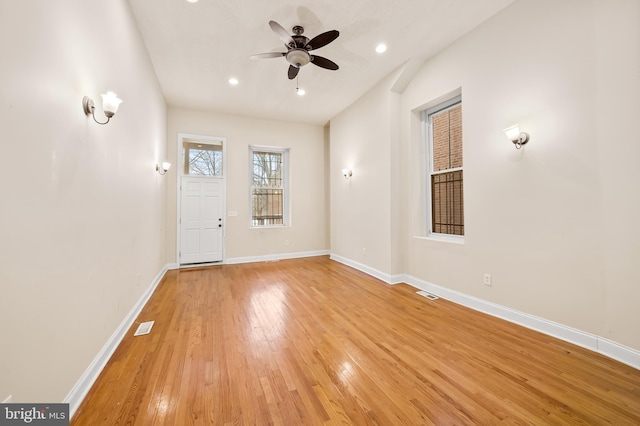 unfurnished room with ceiling fan and light hardwood / wood-style flooring