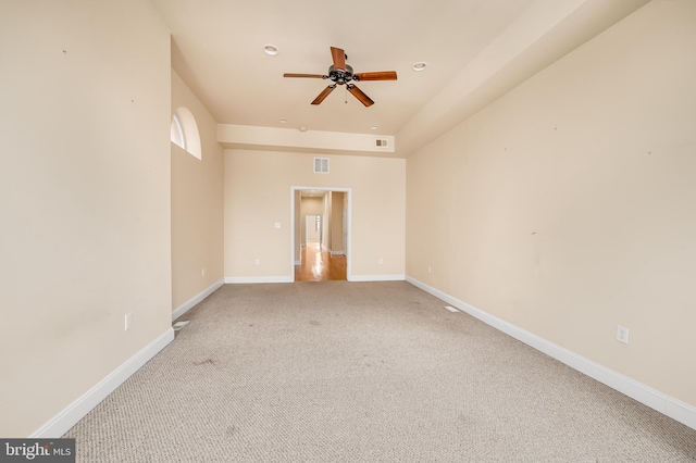 carpeted empty room with ceiling fan