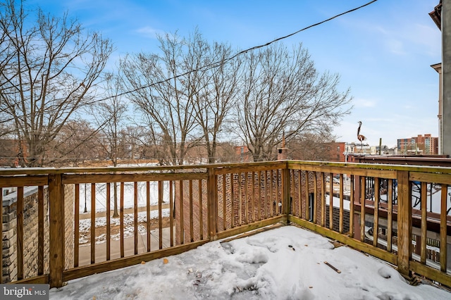 view of snow covered deck