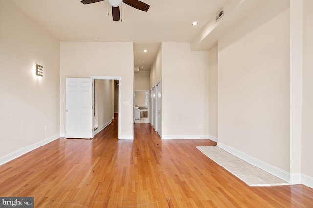 spare room featuring ceiling fan and light wood-type flooring