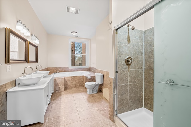 full bathroom featuring toilet, vanity, tile patterned flooring, and plus walk in shower