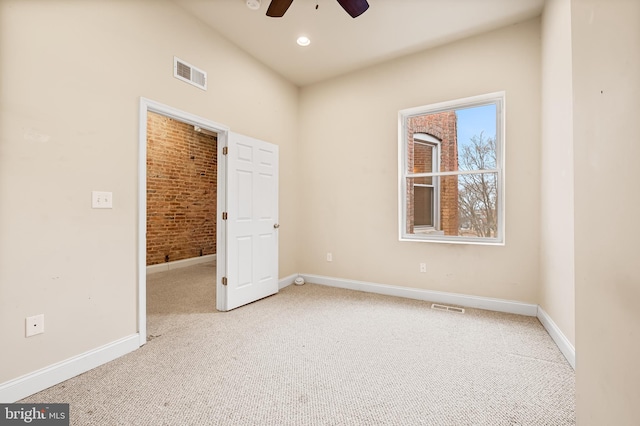 unfurnished bedroom with ceiling fan and light carpet