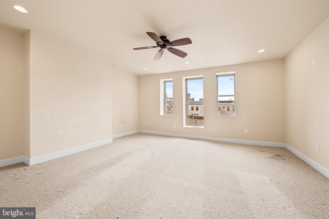 carpeted empty room with ceiling fan