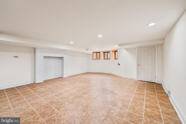 basement featuring light tile patterned floors