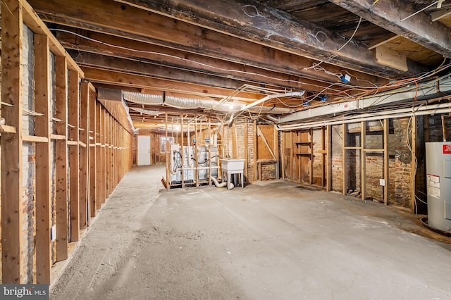 basement with water heater and sink