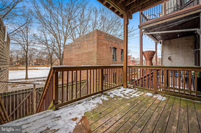 view of snow covered deck