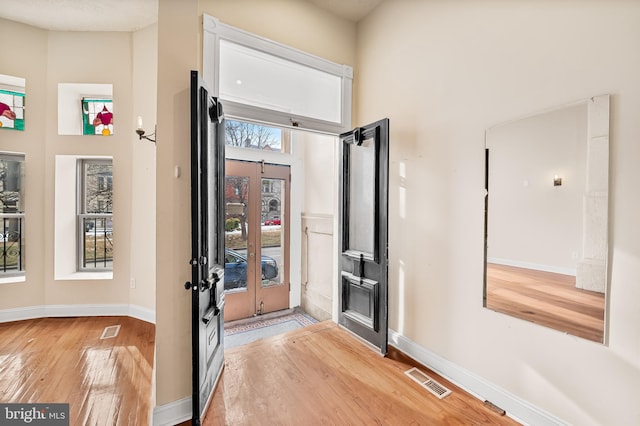 entrance foyer with light hardwood / wood-style flooring