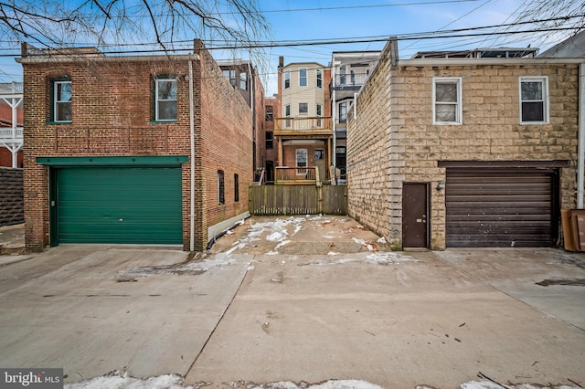 multi unit property featuring a garage